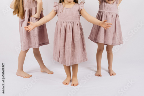 Composition with fashionable children clothes on white background