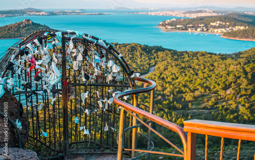 Devil's Table know as Seytan Sofrasi , Ayvalik.  Place devil's footprint, It's believed, if you tie a ribbon with wish to iron fence, it will come true photo