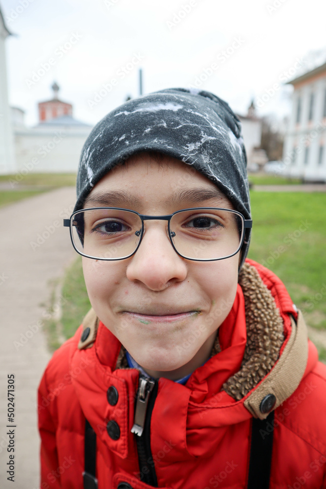portrait of a funny young boy with glasses portrait of a funny young boy with glasses