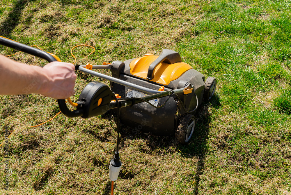 Electric grass aerator. Lawn care Electric grass aerator. Lawn care