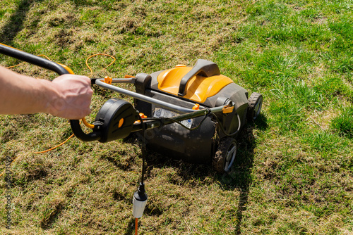 Electric grass aerator. Lawn care photo