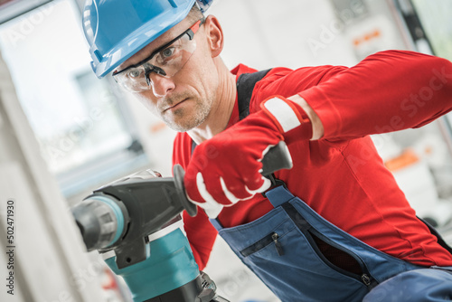 Εκτύπωση καμβά Contractor Worker Drilling Another Hole For an Electric Outlet Point