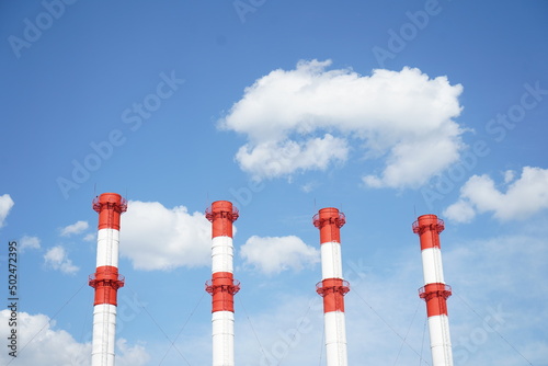 smoke stacks against sky