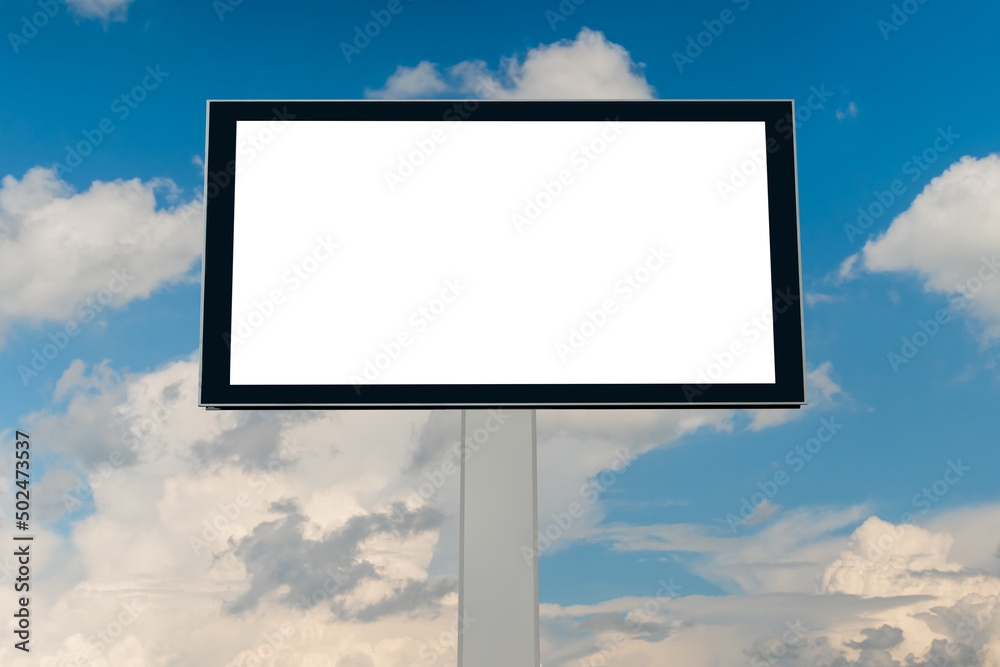 Front view: blank white billboard or large display against blue sky with white clouds - mock up. Copy space, consumerism, advertising, white screen, template and mockup concept Front view: blank white billboard or large display against blue sky with white clouds - mock up. Copy space, consumerism, advertising, white screen, template and mockup concept