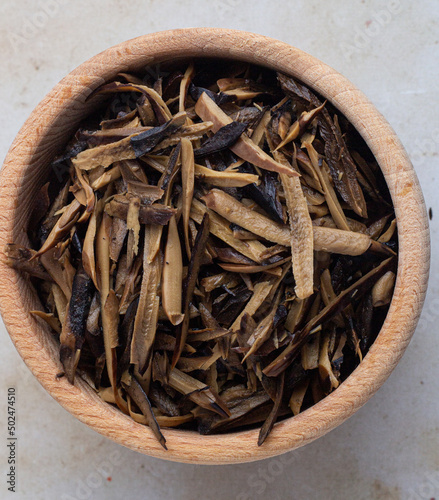African oil bean seed - Ugba. Sliced in a wooden bowl photo