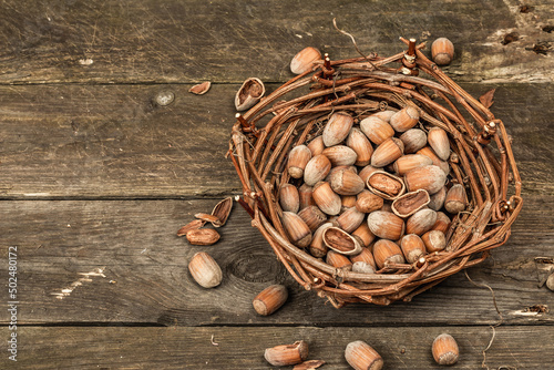 Ripe hazelnuts in shells. Harvest in a wicker basket, a healthy ingredient for snacks