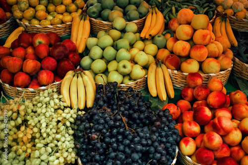 Fototapeta Naklejka Na Ścianę i Meble -  Fresh fruits. beautifully organized fruits on the counter of the marketplace. greengrocery shop