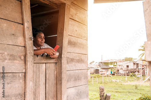 Obraz na plátně Mestizo woman inside her wooden house in a rural community in the Caribbean of N