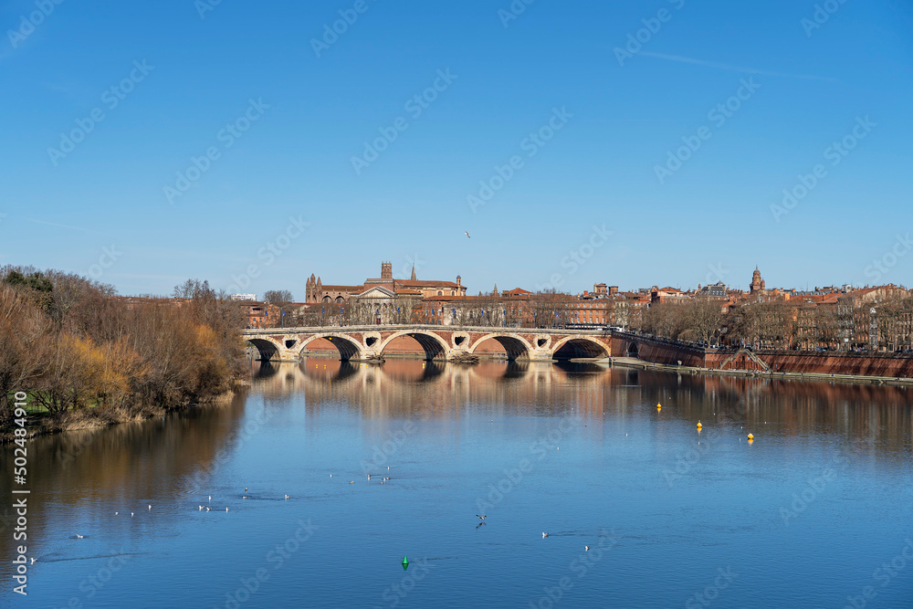 View of the bridge over the river Garonne. City of Toulouse, France.