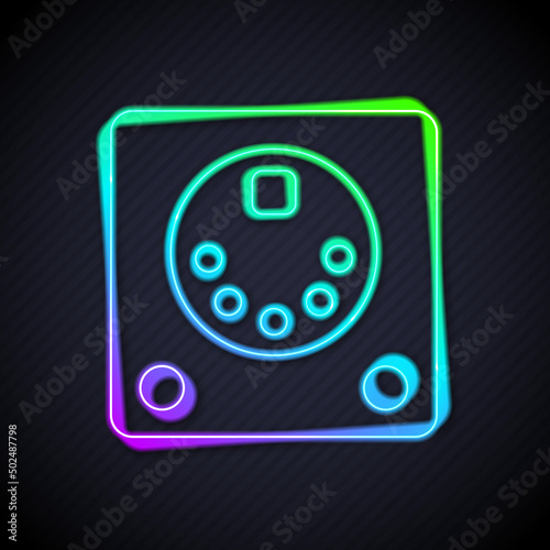 Glowing neon line Drum machine icon isolated on black background. Musical equipment. Vector