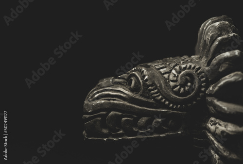 Macro close up photograph of a Quetzalcoatl, deity in Aztec culture photo