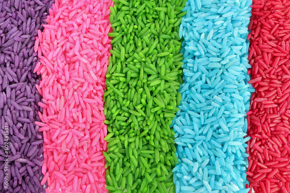 Close up of colored rice on a white background. rainbow color rice