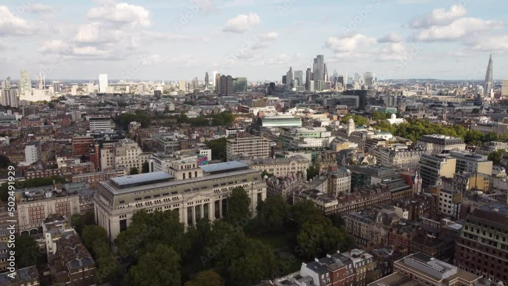 Drone view of the streets of Bloomsbury with skyscrapers in the background. Drone view of the streets of Bloomsbury with skyscrapers in the background.