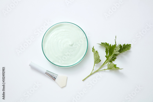 Mugwort extract decorated petri dish in white background 