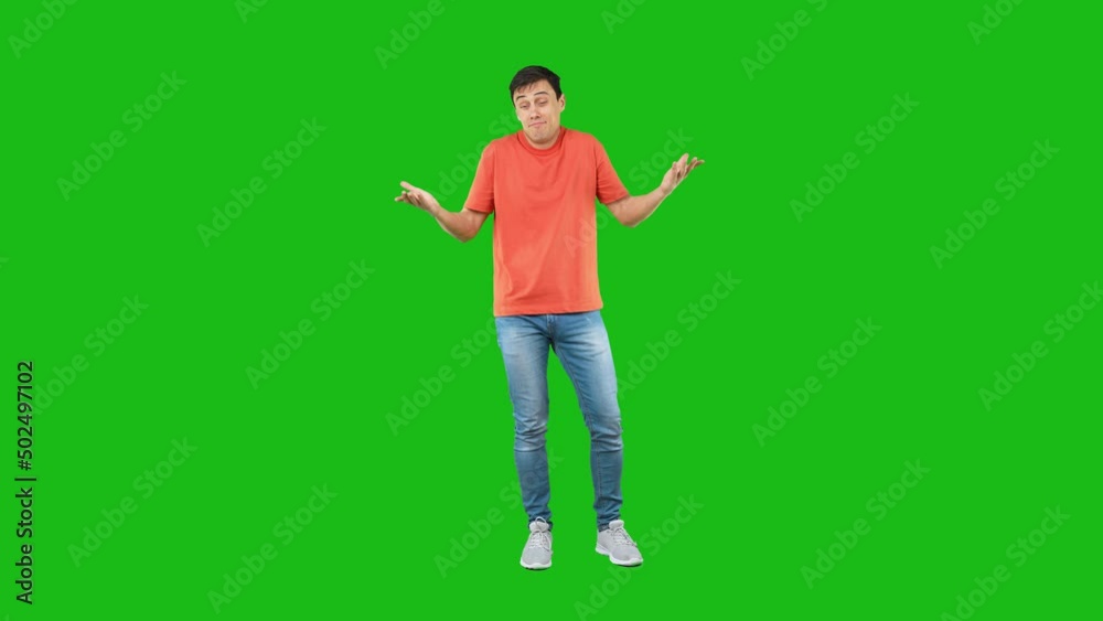 Content young guy showing thumb up and smiling