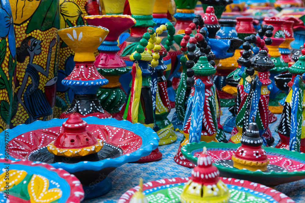 Fototapeta premium Beautiful painted colorful terracotta pots, works of handicraft, for sale during Handicraft Fair in Kolkata.
