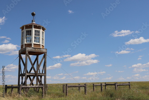A guard tower stands watch over the landscape at Amache National Historic Site, a Japanese Internment camp in Southeast Colorado photo