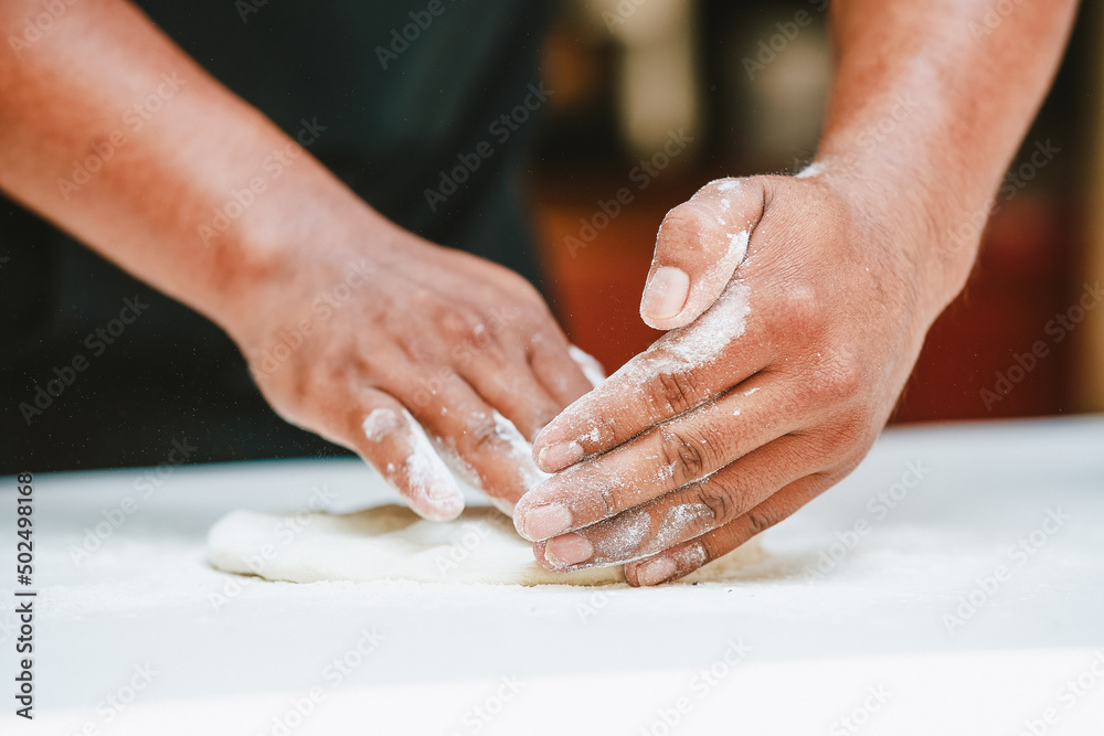 Latino man preparing artisanal pizza. Making pizza in a wood oven, vegan pizza, pizza amazon. Cheese and tomato on pizza. Fast food preparation. Tomato sauce, cheese and tomato. Latino man preparing artisanal pizza. Making pizza in a wood oven, vegan pizza, pizza amazon. Cheese and tomato on pizza. Fast food preparation. Tomato sauce, cheese and tomato.