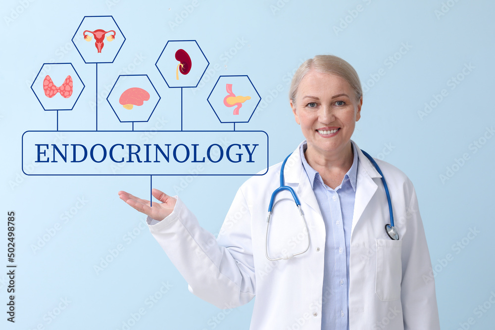Mature female endocrinologist on light color background Mature female endocrinologist on light color background