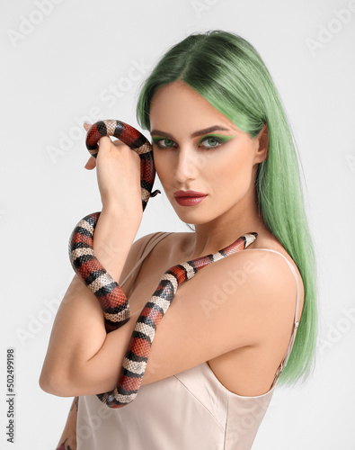 Sexy young woman with green...