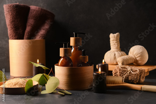 Cosmetic products and spa accessories on dark background