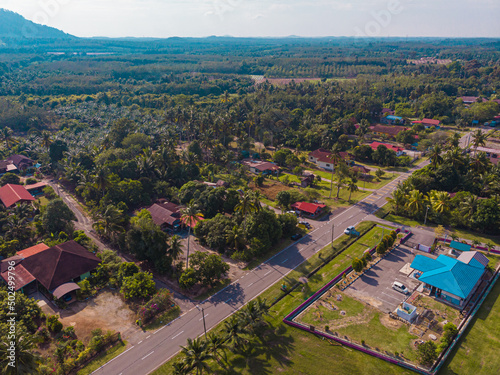 Aerial drone view of houses from top view which is located in Chabau, Melaka, Malaysia. photo