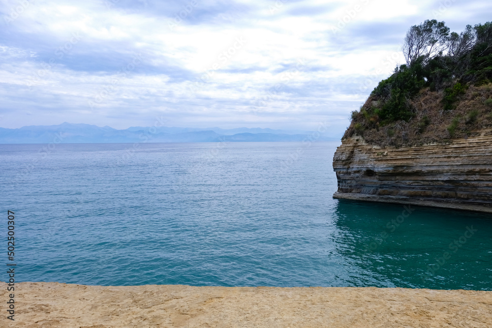 Fototapeta premium Beautiful view of picturesque sea and cliff at resort