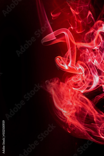 Red smoke motion on black background.