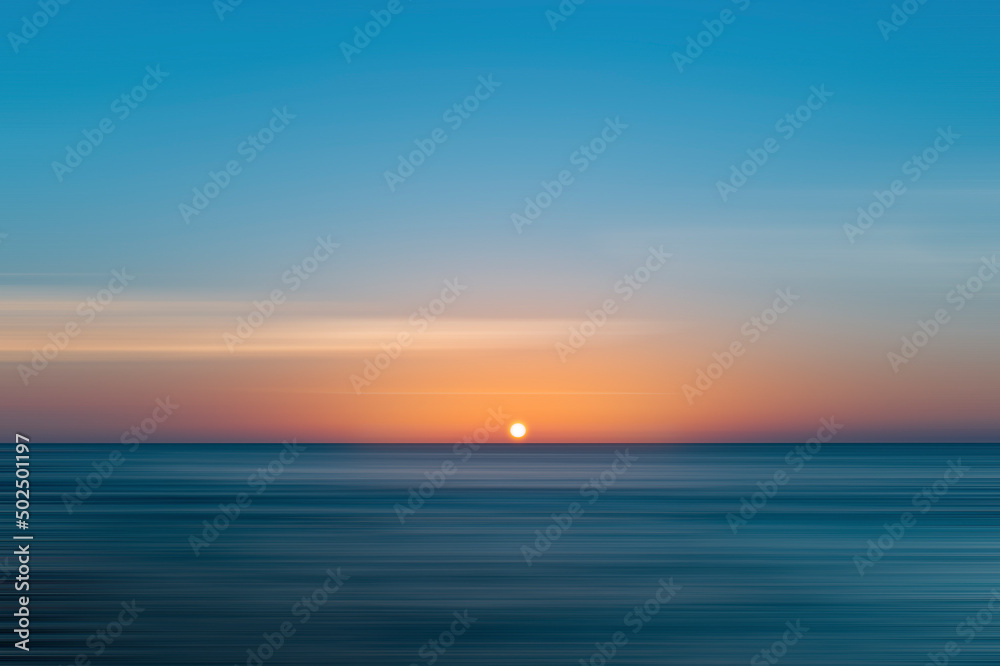 Beautiful sunset over the sea, with sweeping technique.