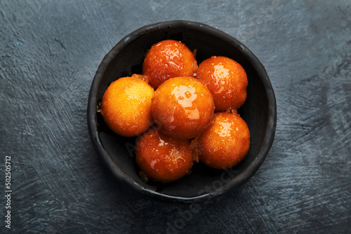 Gulab Jamun on gray background. photo