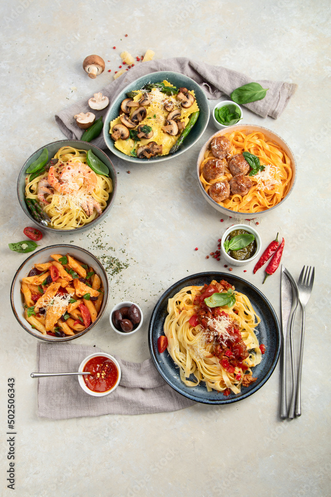 Italian pasta assortment on light background. Italian pasta assortment on light background.