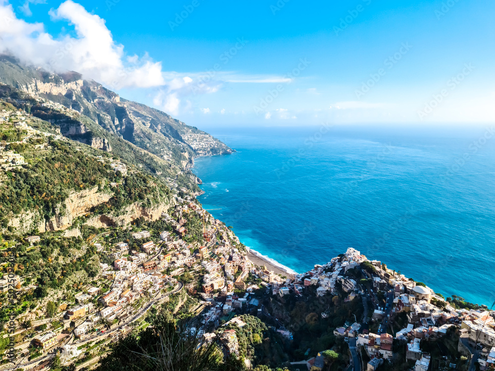 Scenic aerial view from hiking trail leading to coastal town of Positano, Praiano. Hiking Lattari Mountains, Apennines, Amalfi Coast, Campania, Italy, Europe. Vacation at Tyrrhenian Mediterranean Sea