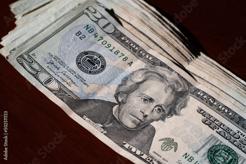 stack of twenty dollars banknotes, close up, front side