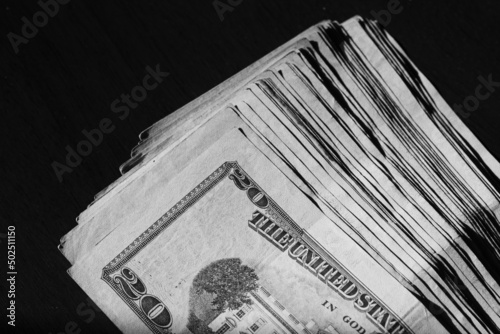 stack of twenty american dollars banknotes on table, close up, reverse side