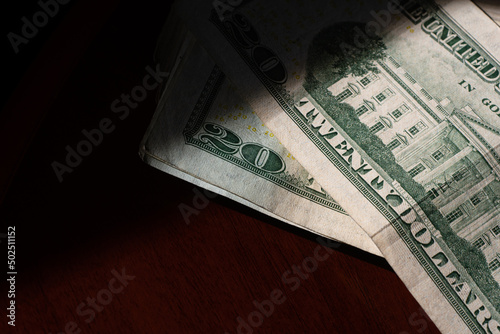 stack of twenty american dollars banknotes on table, close up, reverse side