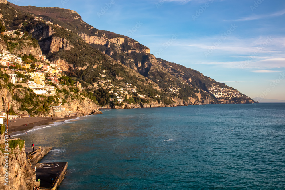 Panoramic view from Fornillo Beach on the coastal towns Positano and Praiano at the Amalfi Coast, Italy, Campania, Europe. Vacation at the mountainous  and hilly coastline of the Mediterranean Sea