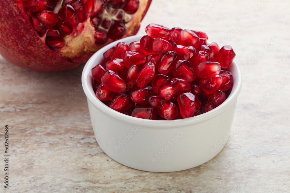 Ripe red Pomegranate seeds in the bowl Ripe red Pomegranate seeds in the bowl