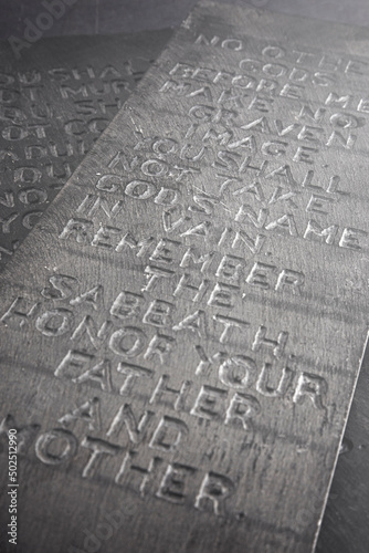 Bild auf Leinwand Ten Commandments Carved into Two Black Stones
