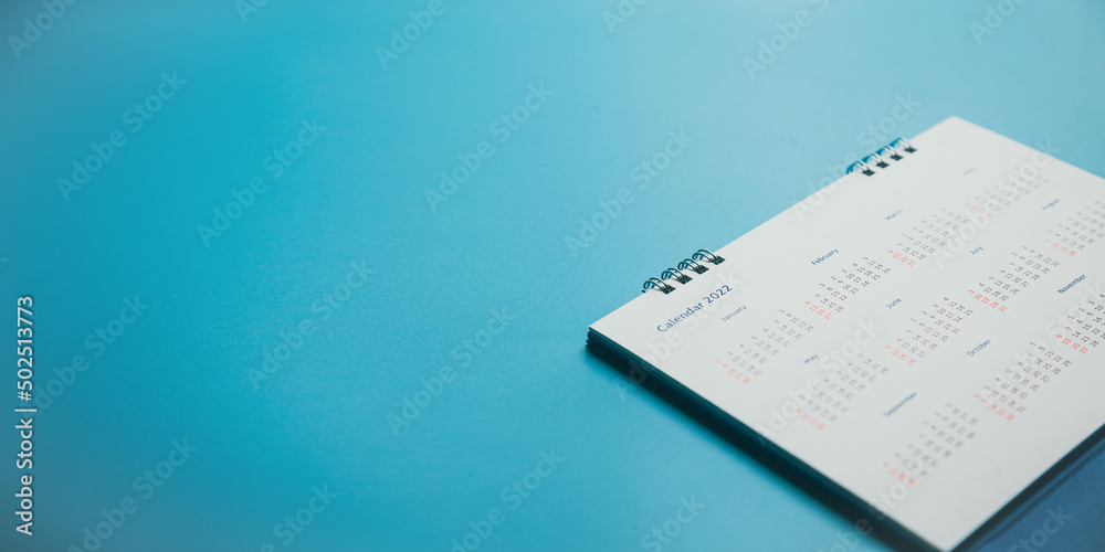 Close top view on white calendar 2022 month schedule Work planning and life concept. Close top view on white calendar 2022 month schedule Work planning and life concept.