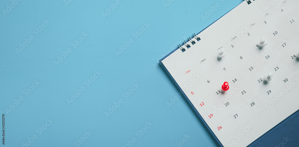 Close top view on white calendar 2022 month schedule Work planning and life concept. Close top view on white calendar 2022 month schedule Work planning and life concept.
