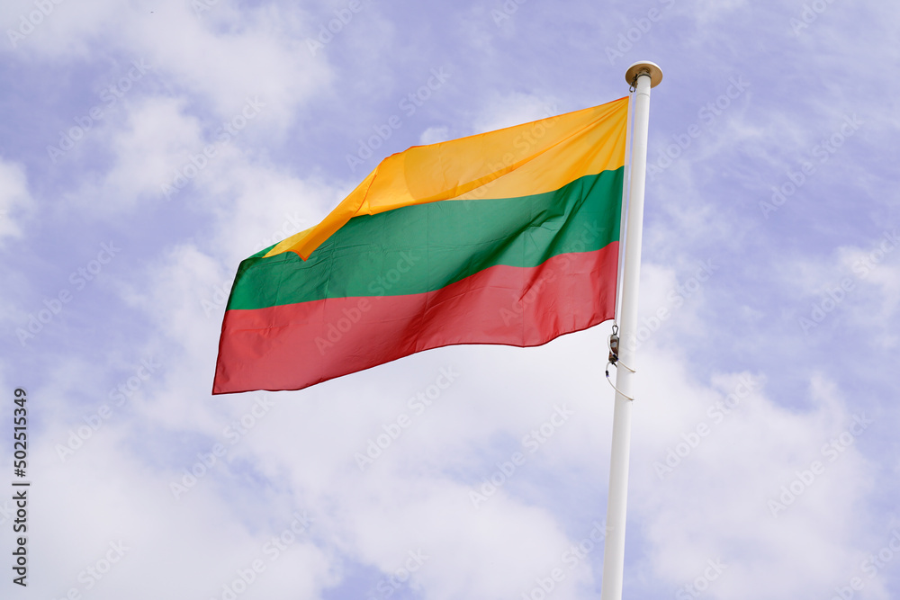 Lithuania Lithuanian flag wave over a cloudy sky Lithuania Lithuanian flag wave over a cloudy sky