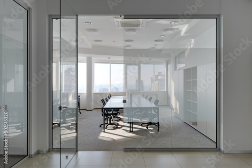 modern bright office with glass partitions, interior of modern office
