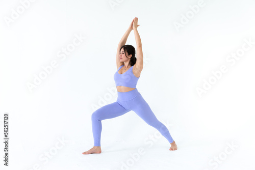 young woman practicing yoga on white background