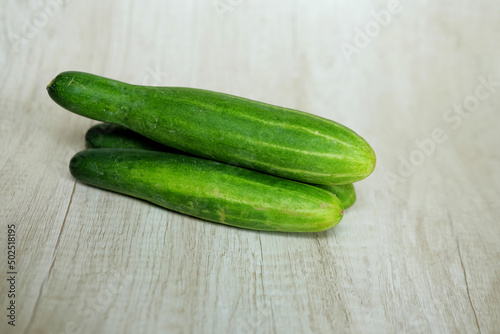 cucumbers on a wooden background