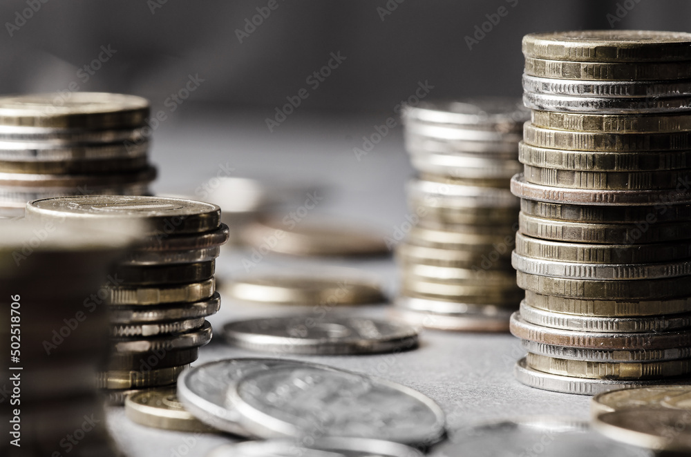 Lots of coins. The concept of investing or saving money or a financial crisis Lots of coins. The concept of investing or saving money or a financial crisis