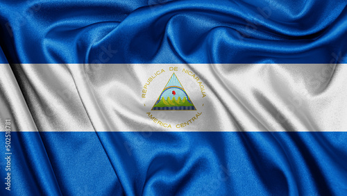 Vászonkép Close up realistic texture fabric textile silk satin flag of Nicaragua waving fluttering background