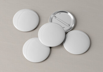 Badge mockup isolated on wood. 3d rendering template of five pins buttons with reflections and shadows.