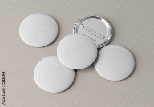 Badge mockup isolated on wood. 3d rendering template of five pins buttons with reflections and shadows.