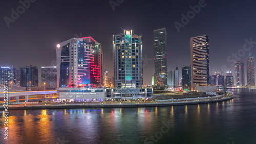Modern city architecture in Business bay district. Panoramic view of Dubai s skyscrapers night timelapse