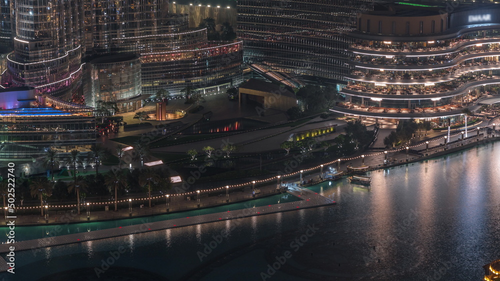 Dubai Fountain aerial night timelapse. Musical fountain, located in an artificial lake in downtown